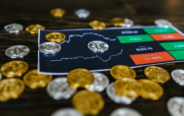 https://www.pexels.com/photo/selective-focus-photo-of-silver-and-gold-bitcoins-8369648/